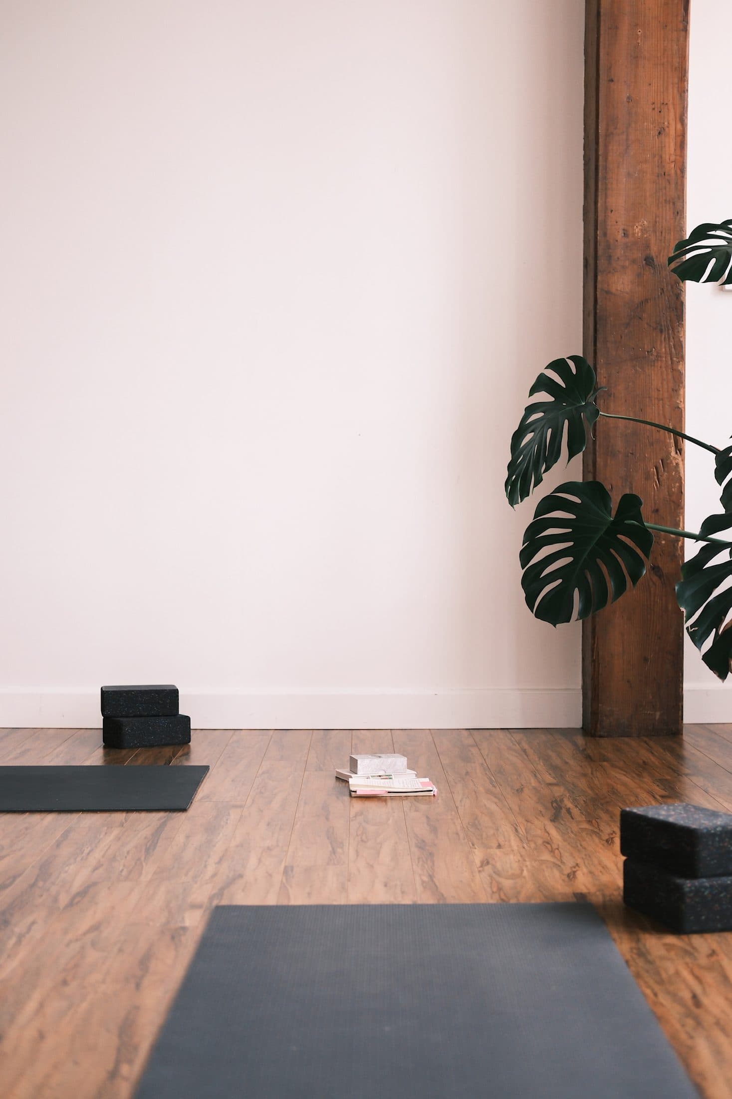 A mat with blocks and an open notebook on the studio floor